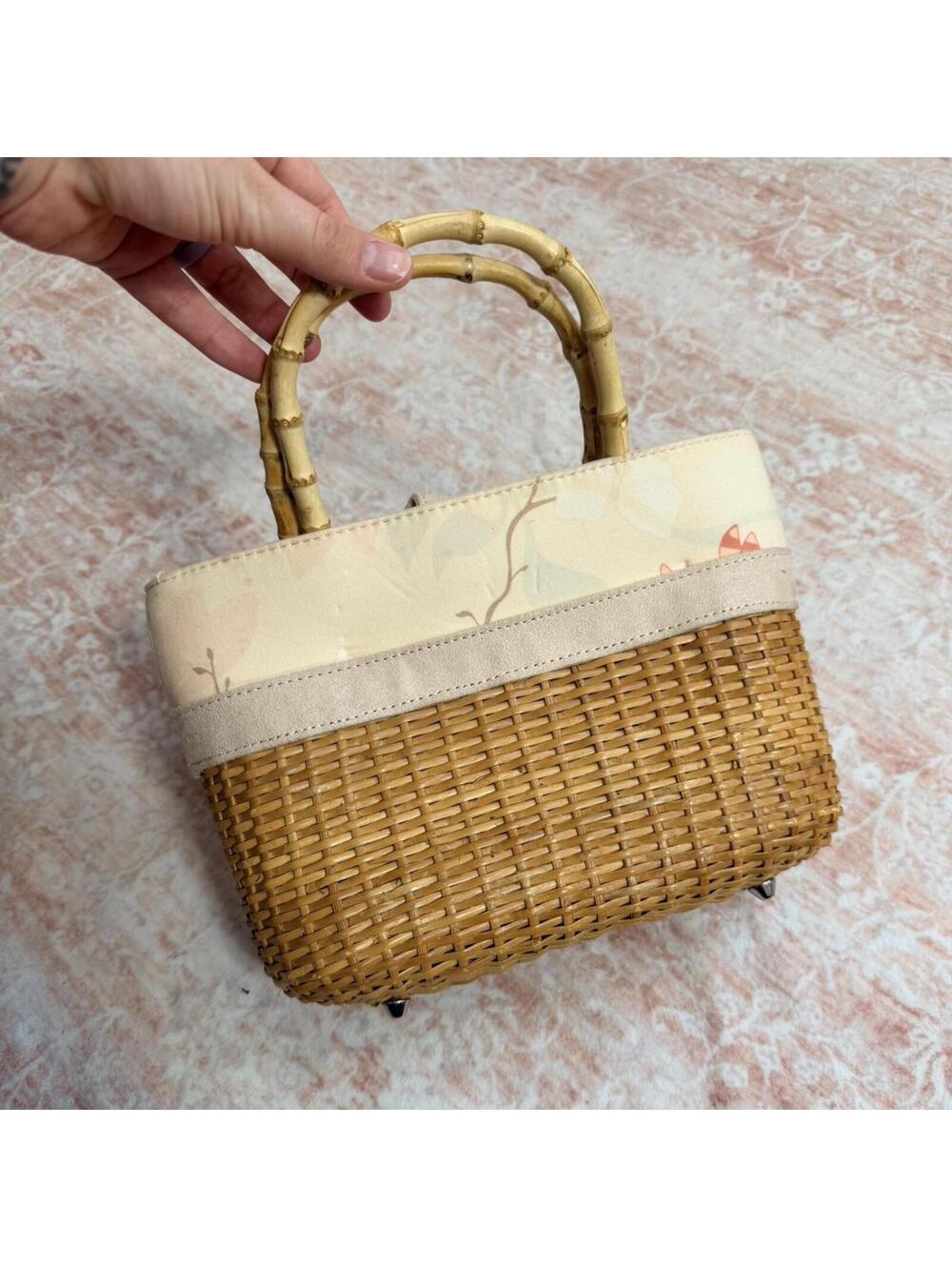 Woven mini handbag from BBW with bamboo-style handles and soft floral detailing